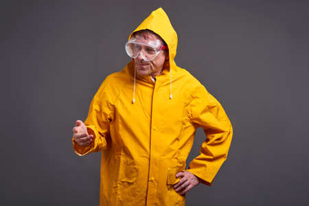 Man in yellow raincoat