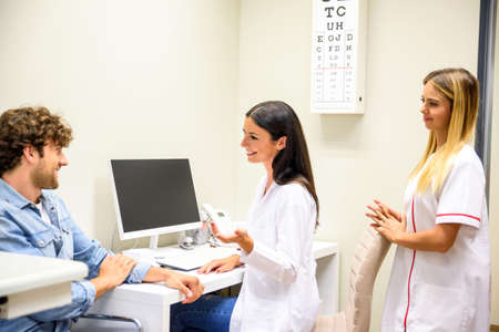 A Doctor with her patient in the consultation roomの写真素材