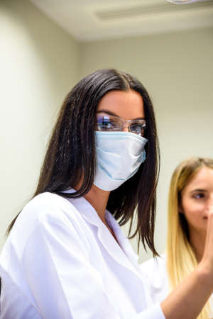 A young female dentist during a Procedureの写真素材