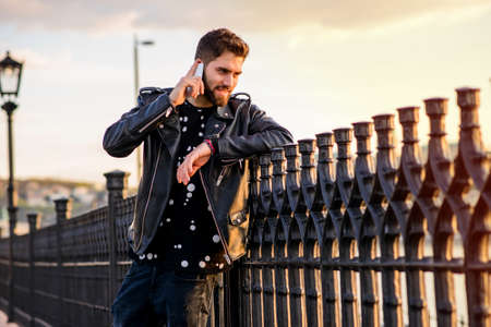 Young man leaning to the fences