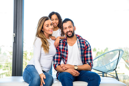 Young parents with their daughterの写真素材