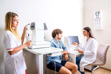 A female Doctor explaining a Diagnosis in the consultation roomの写真素材