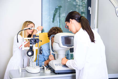 A young man getting a eye checkup at the ophthalmologist