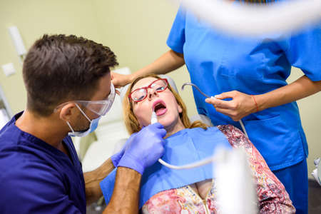 A patient getting attended and treatment in a dental studio