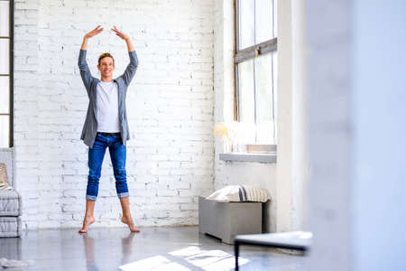 A handsome young male Ballet dancer practicing in a Loft style A