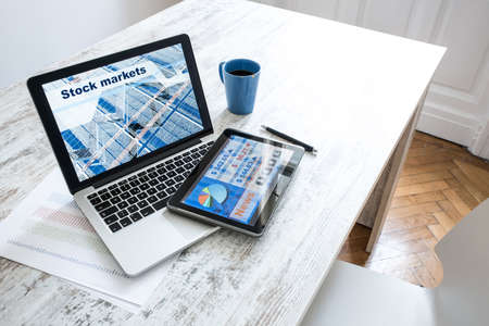 Stock market trading app on a Tablet PC and Laptop PCの写真素材
