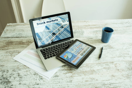 Stock market trading app on a Tablet PC and Laptop PCの写真素材