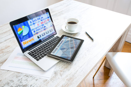 Stock market trading app on a Tablet PC and Laptop PCの写真素材