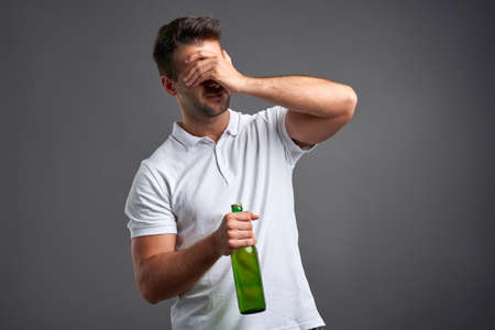 Young man with a beer