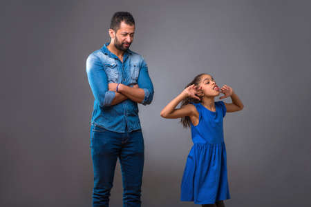 Young black father with his teenage daughterの写真素材