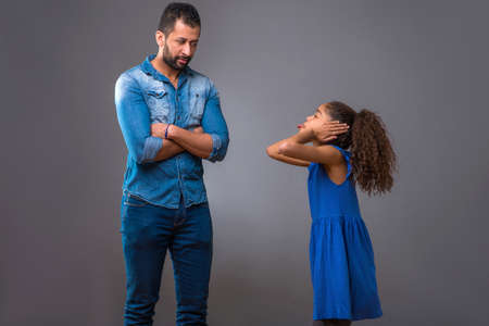 Young black father with his teenage daughterの写真素材
