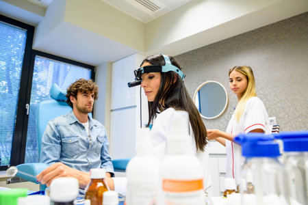 A female ENT specialist during a examinationの写真素材