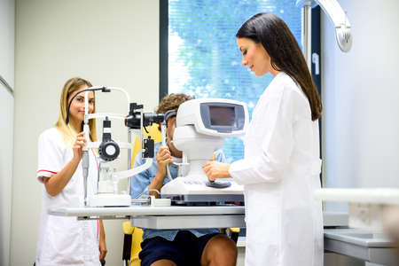 A young man getting a eye checkup at the ophthalmologist