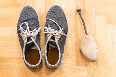 A pair of used sneakersの写真素材