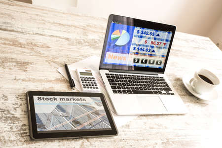 Stock market calculations and trading with a Tablet PC and Laptoの写真素材