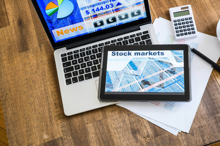 Stock market calculations and trading with a Tablet PC and Laptoの写真素材