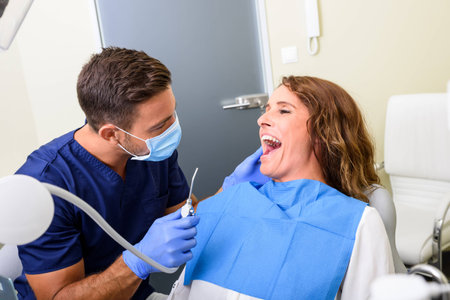 A Dentist attending a female Patientの写真素材