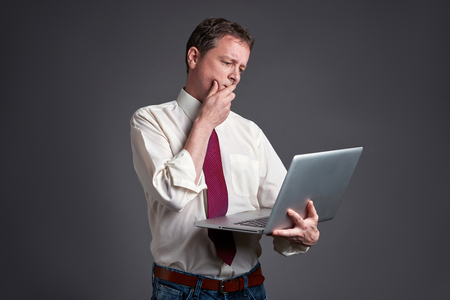 Worried Man with a laptopの写真素材