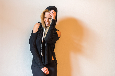 A beautiful young woman posing and wearing black clothes.の写真素材