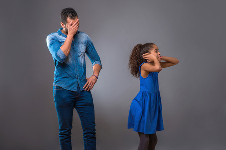 Young black father with his teenage daughterの写真素材