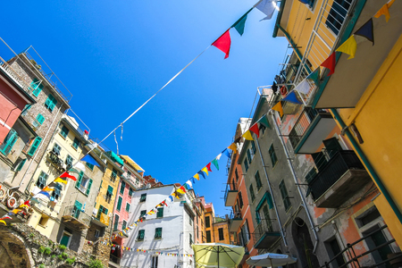 View over the the historic architecture of Cinque Terre, Italy with colourful houses on a sunny day.の写真素材