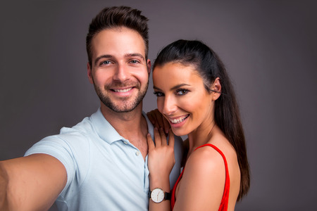 Nice young couple in the studioの写真素材