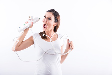A beautiful young woman feeling happy with power cables in her hands