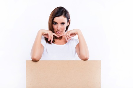 Smiling woman with a signboardの写真素材