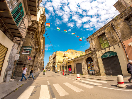 PALERMO, ITALY - CIRCA JUNE 2018: View on pedestrians as they walk by the famous walking street in the city centre on a sunny day circa June 2018 in Palermo, Italy.のeditorial素材