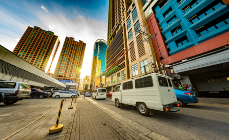 MANILA, PHILIPPINES - CIRCA MARCH 2018: View on daily life on the streets of the city as cars and pedestrians pass by during the day circa March, 2018 in Manila, Philippines.のeditorial素材