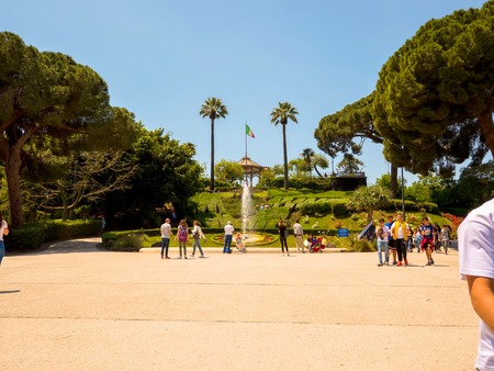 CATANIA, ITALY - CIRCA JUNE 2018: View on people as they pass by at the historic Bellini Garden park on a sunny day circa June 2018 in Catania, Italy.のeditorial素材