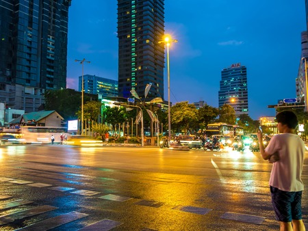 BANGKOK, THAILAND - CIRCA MARCH 2018: View on a busy street traffic passes by at night circa March, 2018 in Bangkok, Thailand.のeditorial素材