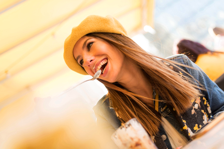 A beautiful young woman enjoying her ice coffee.の写真素材