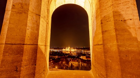 View on the illuminated building of the Hungarian Parliament from the tower of the Fishermans bastion in Budapest, Hungary.の写真素材