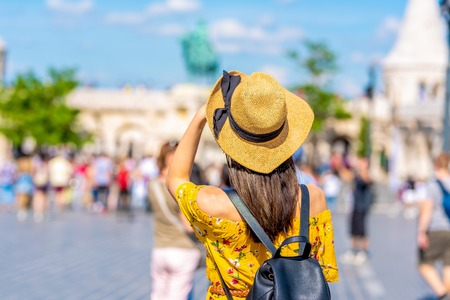 A beautiful young woman discovering the city of Budapest in Hungary during summer.の写真素材