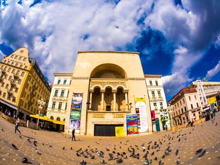 TIMISOARA, ROMANIA - OCTOBER 15: View on people as they pass by at the historical building of the Romanian National Opera on a sunny day on October 15, 2017 in Timisoara, Romania.のeditorial素材