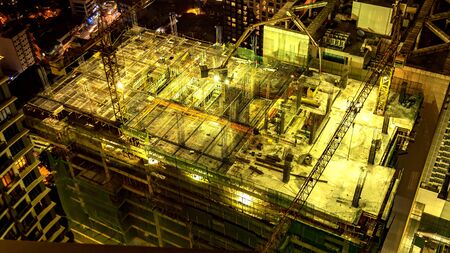 MANILA, PHILIPPINES - CIRCA MARCH 2018: View on construction site of a skyscraper at night circa March, 2018 in Manila, Philippines.のeditorial素材