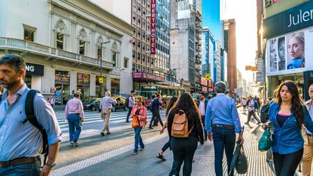 BUENOS AIRES, ARGENTINA - CIRCA NOVEMBER 2018: View on traffic and pedestrians pass by in the center of the city circa November 2018 in Buenos Aires, Argentina.のeditorial素材