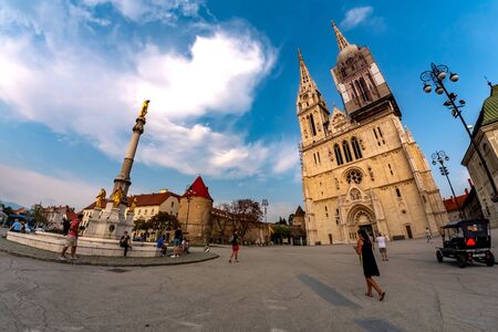 ZAGREB, CROATIA - CIRCA AUGUST 2019: View on pedestrians and tourists as they pass by at the Cathedral of the city circa August 2019 in Zagreb, Croatia.のeditorial素材