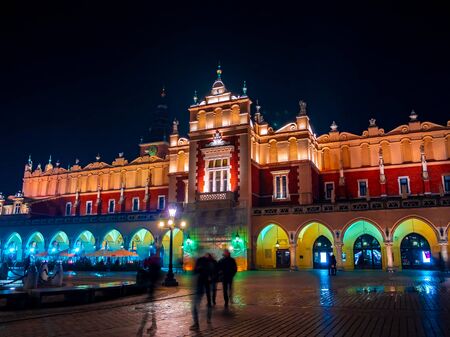 KRAKOW, POLAND - CIRCA NOVEMBER 2019: View on Restaurants as pedestrians pass by in the historic center of the city circa November 2019 in Krakow, Poland..のeditorial素材
