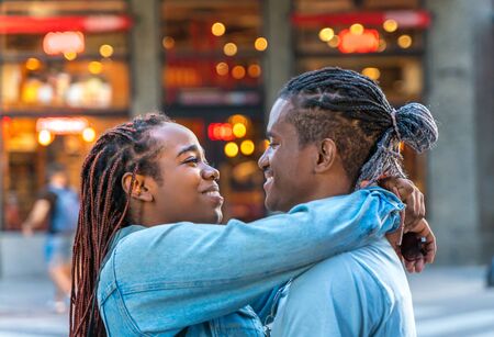 A loving couple hugging in the city.の写真素材