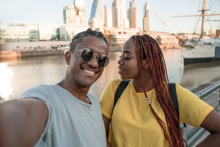 Selfie of a happy loving couple in Puerto Madero in Buenos Aires in Argentina.の写真素材