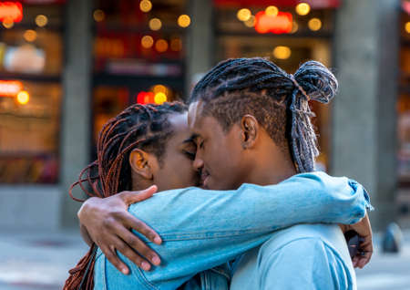 A loving couple hugging in the city.の写真素材