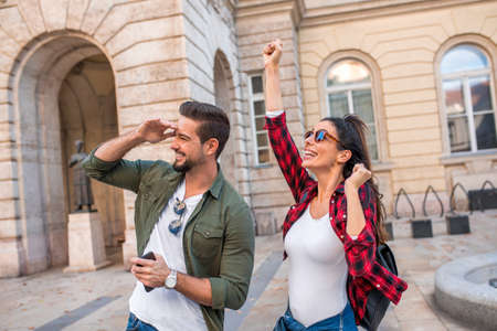 A beautiful couple making exciting discovering while traveling and visiting a European city..の写真素材