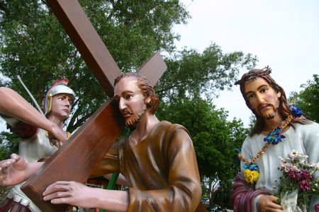 Statues of Simon of Cyrene and Christ outside St. Anne's Church, Penang. In this scene, Simon of Cyrene is forced to carry the cross for Jesus as a Roman soldier watches onの写真素材