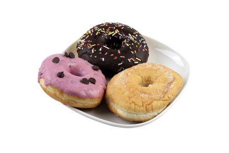 Three doughnuts on a plate isolated in white backgroundの写真素材
