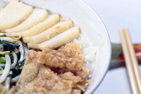 A bowl of Chinese flat noodles or 'koay teow' with fish cakes, bean sprouts and 'fuchuk'の写真素材