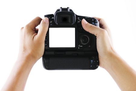 A pair of hands holding a digital camera.の写真素材