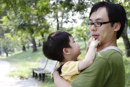 A father and his son at a parkの写真素材
