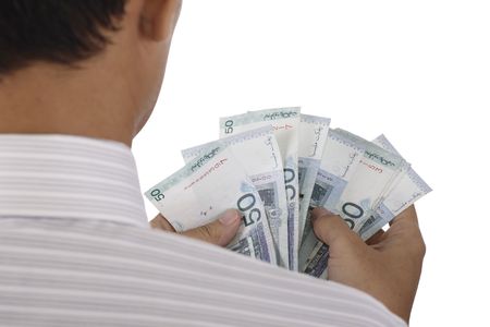 An Asian man counting some cashの写真素材